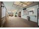 Enclosed sun room with carpet flooring, white lattice, and natural light at 6513 Hyde Ave, Las Vegas, NV 89107