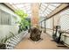 Enclosed sun room featuring a tree in the center at 6513 Hyde Ave, Las Vegas, NV 89107