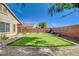 Backyard putting green with rock landscaping and a block wall provides a private oasis at 6656 Arctic Breeze St, North Las Vegas, NV 89084