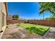 Private backyard featuring a personal putting green and low-maintenance landscaping at 6656 Arctic Breeze St, North Las Vegas, NV 89084