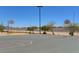 Outdoor basketball court in a residential community featuring two hoops at 6656 Arctic Breeze St, North Las Vegas, NV 89084