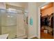 Shower room featuring a glass door and a view of the closet, offering convenience and functionality at 6656 Arctic Breeze St, North Las Vegas, NV 89084