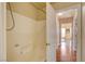Neutral bathroom with shower and wood-look tile flooring at 6656 Arctic Breeze St, North Las Vegas, NV 89084