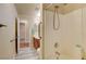 Neutral bathroom with shower and wood-look tile flooring at 6656 Arctic Breeze St, North Las Vegas, NV 89084