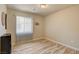 Neutral bedroom with plank flooring and natural light at 6656 Arctic Breeze St, North Las Vegas, NV 89084