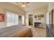 Bright bedroom boasts tile floors, neutral paint, and natural light streaming in through the window at 6656 Arctic Breeze St, North Las Vegas, NV 89084