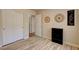 Neutral bedroom with closet, wood-look tile flooring, and decoratively adorned walls at 6656 Arctic Breeze St, North Las Vegas, NV 89084