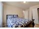 Bedroom with a floral comforter, providing a cozy and inviting space for relaxation at 6656 Arctic Breeze St, North Las Vegas, NV 89084