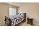 Comfortable bedroom with natural light, stylish bedding, and a sleek bedside table at 6656 Arctic Breeze St, North Las Vegas, NV 89084