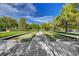 Bocce ball court for community recreation with blue sky and mature trees at 6656 Arctic Breeze St, North Las Vegas, NV 89084
