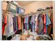 Walk-in closet with ample hanging space and storage bins, offering an organized and functional storage solution at 6656 Arctic Breeze St, North Las Vegas, NV 89084