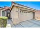 Charming single-story home with a two-car garage and desert landscaping in a well-kept neighborhood at 6656 Arctic Breeze St, North Las Vegas, NV 89084