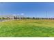 Expansive grassy field area with mountain views, perfect for outdoor activities and recreation at 6656 Arctic Breeze St, North Las Vegas, NV 89084