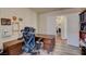 Office with desk, storage, and wood-look tile flooring at 6656 Arctic Breeze St, North Las Vegas, NV 89084