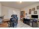 Office with desk, storage and wood-look tile flooring at 6656 Arctic Breeze St, North Las Vegas, NV 89084