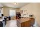 Office with large desk and wood-look tile flooring at 6656 Arctic Breeze St, North Las Vegas, NV 89084