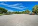 Well-maintained sand volleyball courts with nets, trees, and sunny skies at 6656 Arctic Breeze St, North Las Vegas, NV 89084