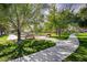 Picturesque walking path surrounded by trees, grass, and community recreation areas at 6656 Arctic Breeze St, North Las Vegas, NV 89084
