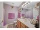 Well-lit bathroom featuring a vanity, mirror, and a shower with a curtain at 700 Capri Dr # 27B, Boulder City, NV 89005