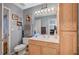 Charming bathroom with cat-themed decor and a wooden vanity cabinet at 700 Capri Dr # 27B, Boulder City, NV 89005
