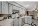 Well-lit kitchen with stainless steel appliances, ample cabinetry, and an adjacent dining area at 700 Capri Dr # 27B, Boulder City, NV 89005