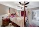 Cozy main bedroom featuring a four-poster bed, ceiling fan, and decorative accents at 700 Capri Dr # 27B, Boulder City, NV 89005