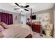 Comfortable main bedroom with a TV, ceiling fan, and decorative accents at 700 Capri Dr # 27B, Boulder City, NV 89005