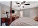 Comfortable main bedroom with a TV, ceiling fan, and neutral color scheme at 700 Capri Dr # 27B, Boulder City, NV 89005