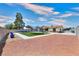 Fenced backyard features a trampoline and well-maintained landscaping at 706 Red Lake Way, Las Vegas, NV 89110