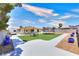 Spacious backyard with a trampoline and seating area perfect for outdoor entertaining at 706 Red Lake Way, Las Vegas, NV 89110