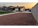 View of backyard with trampoline and perimeter block wall at 706 Red Lake Way, Las Vegas, NV 89110