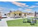 Backyard view with well manicured landscaping and a trampoline at 706 Red Lake Way, Las Vegas, NV 89110