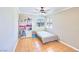Cozy bedroom featuring neutral walls, tile floors, and a ceiling fan at 706 Red Lake Way, Las Vegas, NV 89110