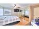 A comfortable bedroom featuring tile flooring, a ceiling fan, and a mirrored closet for ample storage at 706 Red Lake Way, Las Vegas, NV 89110