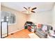 Functional bedroom with desk, chair, tile floors, and a ceiling fan at 706 Red Lake Way, Las Vegas, NV 89110