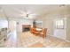 Open dining area featuring tile flooring, a classic brick fireplace, and seating for eight at 706 Red Lake Way, Las Vegas, NV 89110