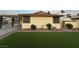 Exterior view of home showing landscaped yard, and carport at 706 Red Lake Way, Las Vegas, NV 89110