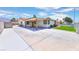 Inviting front exterior with a spacious driveway, covered entrance, and well-maintained landscaping at 706 Red Lake Way, Las Vegas, NV 89110
