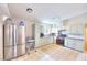 Bright kitchen features modern appliances, tile flooring, and sleek cabinets with updated countertops at 706 Red Lake Way, Las Vegas, NV 89110