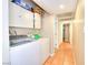 Efficient laundry room with washer, dryer, and overhead storage at 706 Red Lake Way, Las Vegas, NV 89110