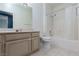 Well-lit bathroom with a large vanity, tile floors, toilet and shower-tub combo at 7155 S Durango Dr # 303, Las Vegas, NV 89113