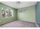 Bright bedroom featuring plush carpet and a window overlooking the neighborhood at 7155 S Durango Dr # 303, Las Vegas, NV 89113
