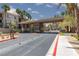 Community entrance with landscaped surroundings and gated access for enhanced security at 7155 S Durango Dr # 303, Las Vegas, NV 89113