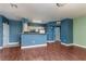 Bright living area flows into kitchen, featuring modern flooring and neutral tones, ideal for entertaining and relaxation at 7155 S Durango Dr # 303, Las Vegas, NV 89113