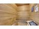 Relaxing sauna room with wooden benches and a traditional rock heater for a soothing experience at 7155 S Durango Dr # 303, Las Vegas, NV 89113