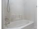 Shower tub combo with white tile and fixtures at 7155 S Durango Dr # 303, Las Vegas, NV 89113