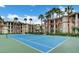 Exterior shot of a community tennis court and residential building at 7155 S Durango Dr # 303, Las Vegas, NV 89113
