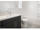 Stylish bathroom featuring a modern vanity, toilet and shower with white subway tiles at 717 Monroe Hill Pl, Henderson, NV 89011