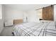 Spacious bedroom features soft carpet, a sliding barn door, and a white rocker at 717 Monroe Hill Pl, Henderson, NV 89011