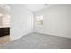 Bright bedroom with plush carpeting, a closet, and a doorway leading to a bathroom at 717 Monroe Hill Pl, Henderson, NV 89011